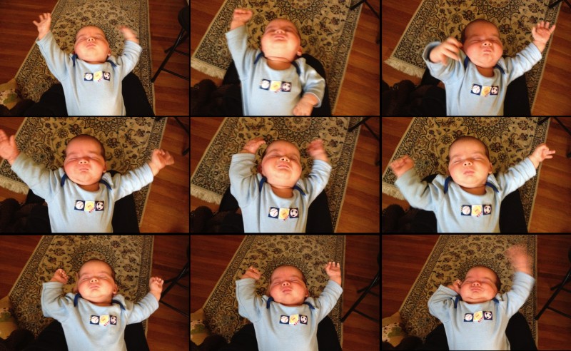 baby boy Maxwell waves his arms around like a symphony conductor