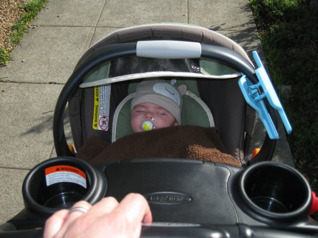 baby boy max rides in a Chicco carseat in a BabyTrend Snap-N-Go stroller, pushed by Ken