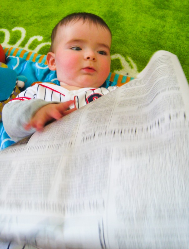 baby boy max reads the San Francisco Chronicle Newspaper