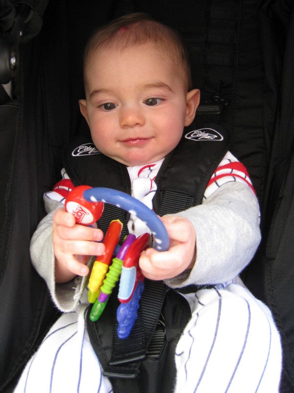 baby boy sam holds onto a keyring with three colorful keys